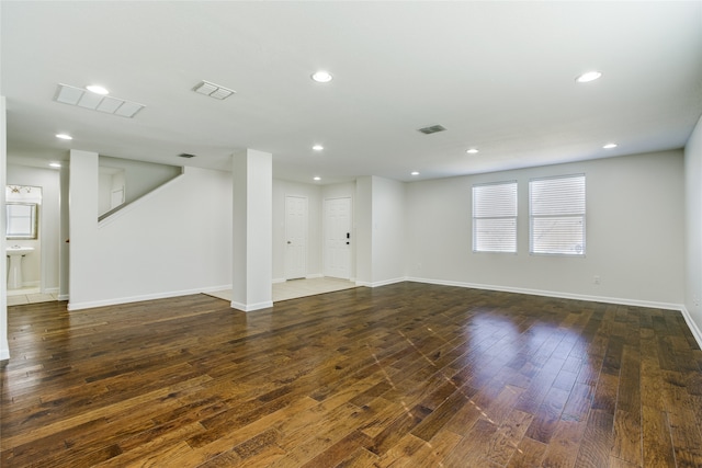 interior space with dark hardwood / wood-style floors