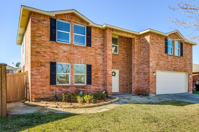 view of front of house featuring a garage and a front lawn