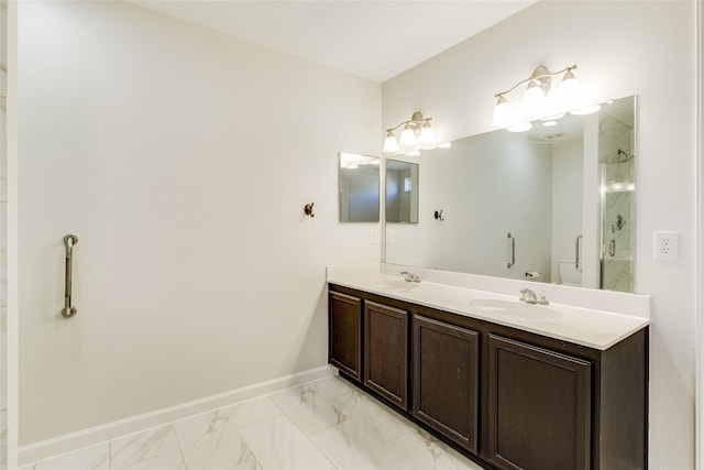 bathroom featuring vanity and a shower with door