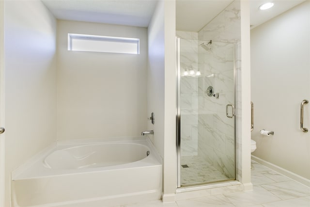 bathroom featuring independent shower and bath and toilet