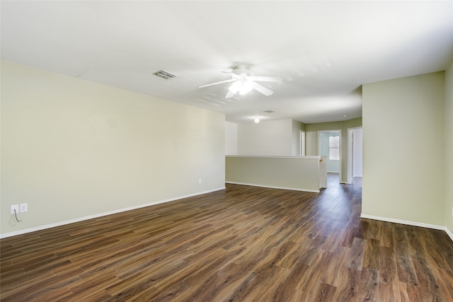 spare room featuring dark hardwood / wood-style floors and ceiling fan