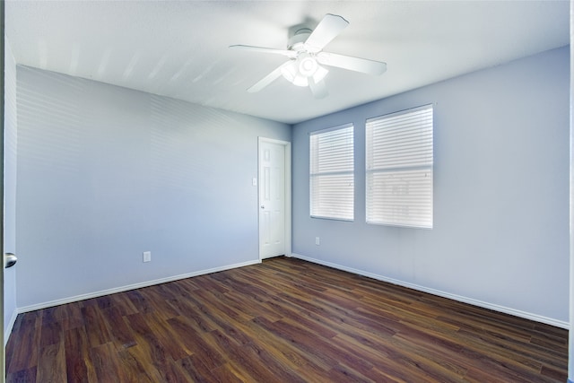 unfurnished room featuring ceiling fan and dark hardwood / wood-style flooring