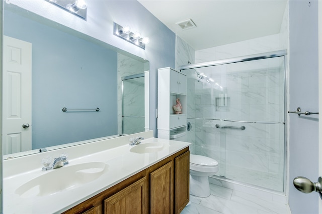 bathroom with vanity, toilet, and walk in shower