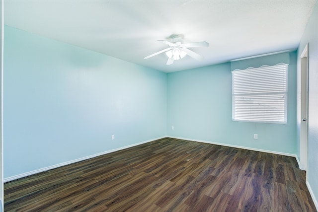 unfurnished room with ceiling fan and dark wood-type flooring