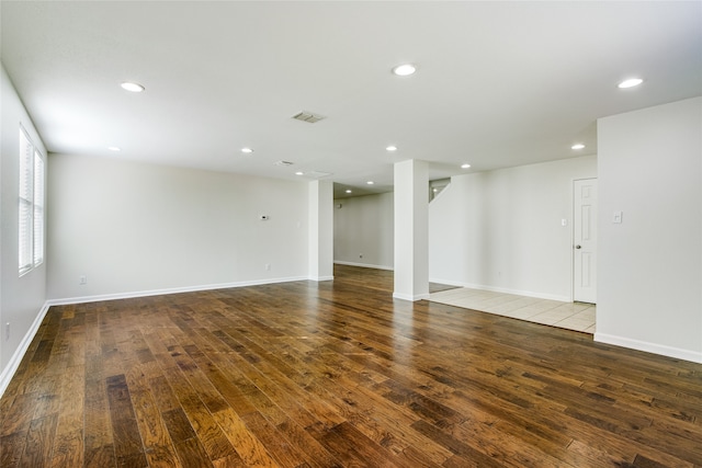 unfurnished room with wood-type flooring