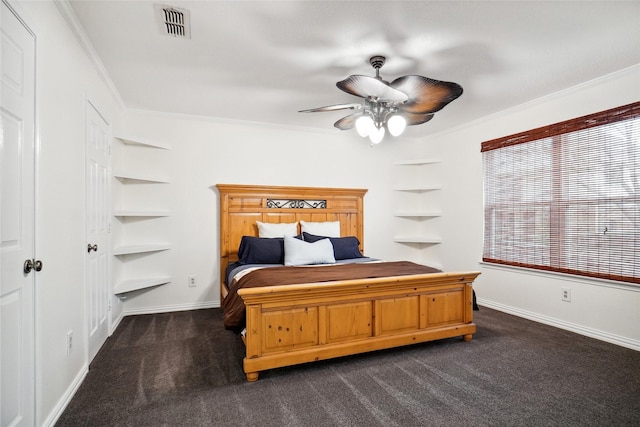 bedroom with baseboards, visible vents, dark colored carpet, and ornamental molding