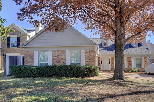 view of front of home with a front yard