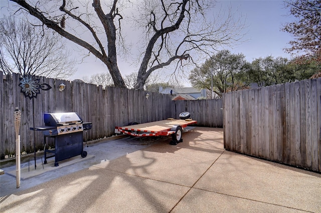 view of patio with a fenced backyard and grilling area