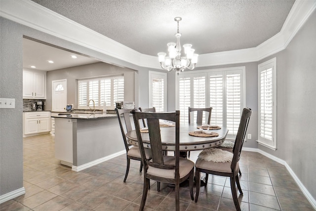 dining area with tile patterned flooring, an inviting chandelier, plenty of natural light, and baseboards