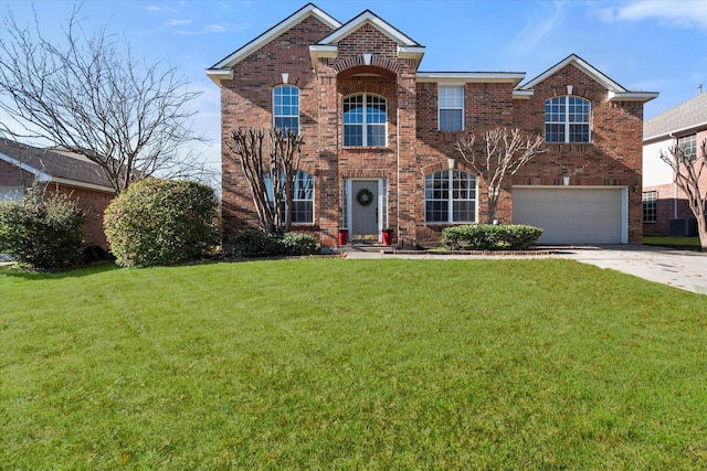 view of front of home with a garage and a front lawn