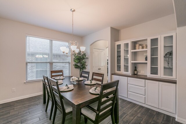 kitchen featuring dark hardwood / wood-style flooring, stainless steel appliances, a kitchen island with sink, sink, and white cabinetry