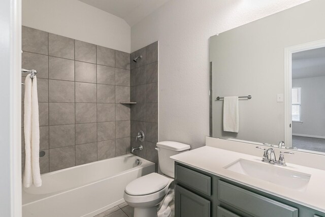 full bathroom with tile patterned flooring, vanity, toilet, and tiled shower / bath