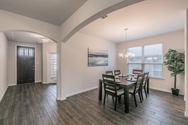 living room with dark hardwood / wood-style floors, ceiling fan, sink, and a tray ceiling