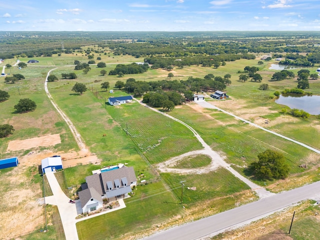 aerial view featuring a rural view and a water view