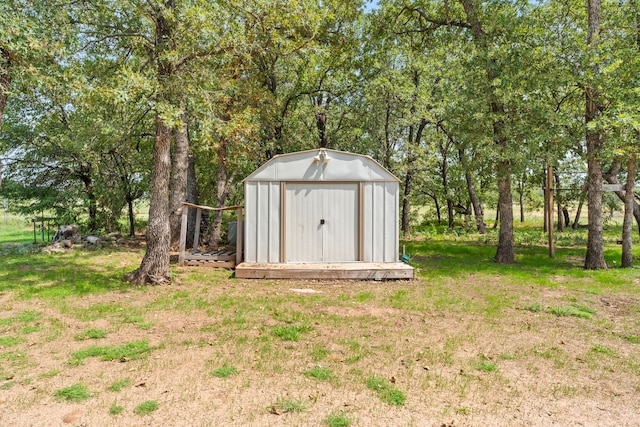 view of outbuilding with a lawn