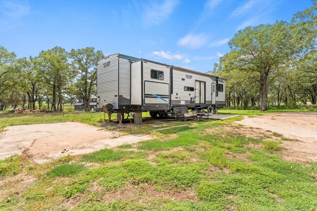 rear view of property with a yard