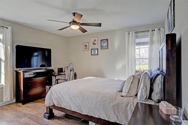 bedroom featuring light hardwood / wood-style flooring and ceiling fan