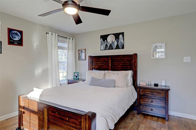 bedroom with ceiling fan and hardwood / wood-style flooring