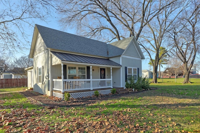 view of front of house featuring covered porch and a front lawn