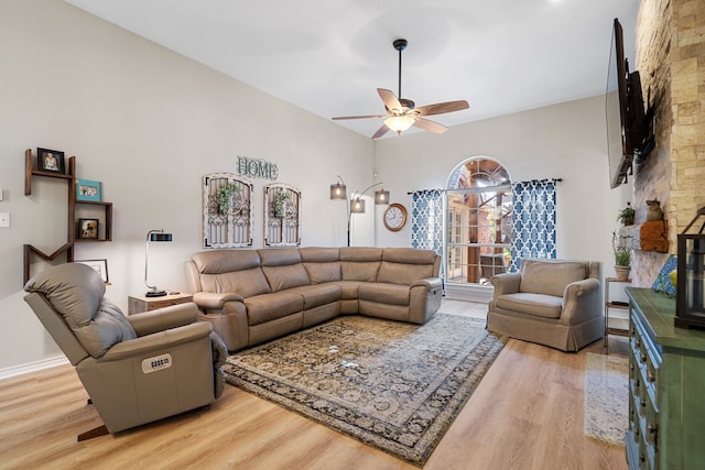 living room with hardwood / wood-style floors and ceiling fan