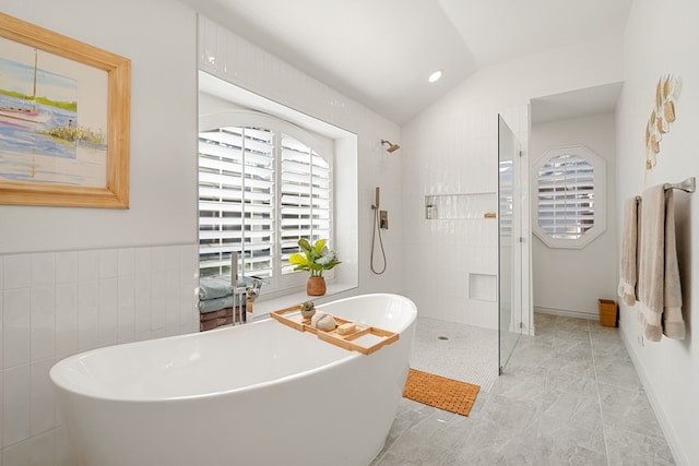 bathroom featuring separate shower and tub and vaulted ceiling