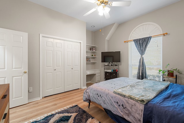 bedroom featuring a closet, light hardwood / wood-style floors, and ceiling fan