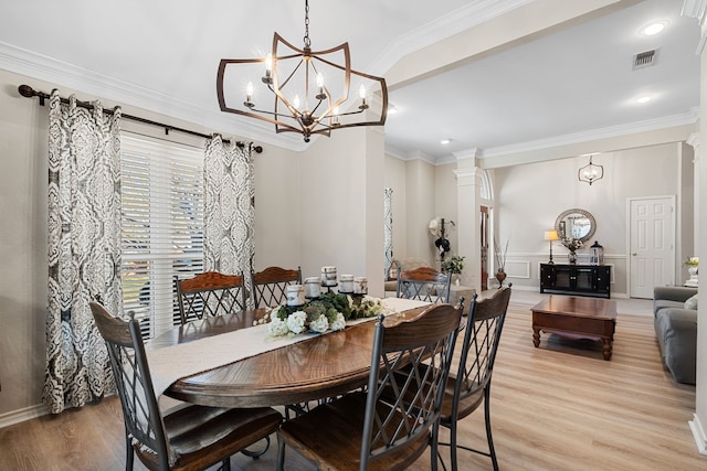 dining space featuring a chandelier, light hardwood / wood-style flooring, and ornamental molding