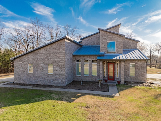 rear view of house with a lawn