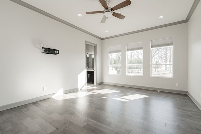 unfurnished living room featuring ornamental molding, ceiling fan, and light hardwood / wood-style flooring