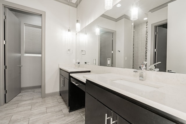 bathroom featuring crown molding and vanity