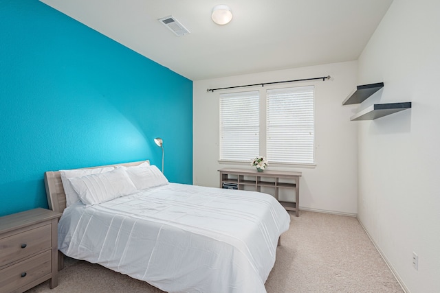 bedroom with light colored carpet