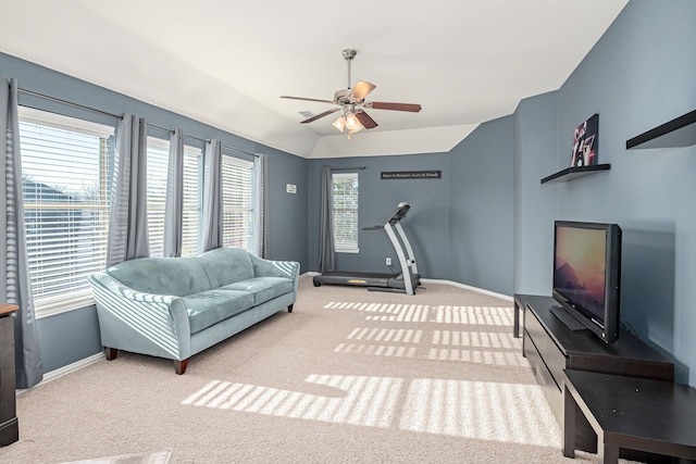 interior space with light colored carpet, vaulted ceiling, and ceiling fan