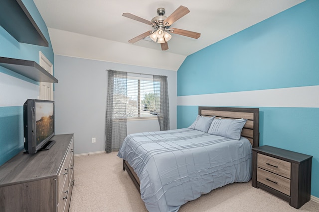 bedroom featuring ceiling fan, light colored carpet, and lofted ceiling