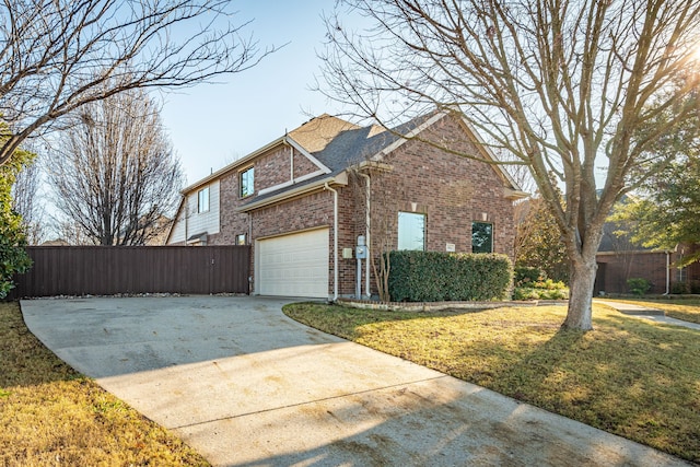 view of side of property featuring a garage and a lawn