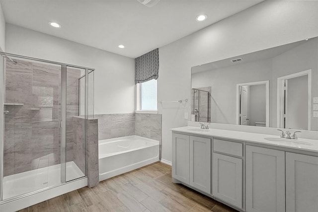 full bathroom with vanity, toilet, and shower with separate bathtub