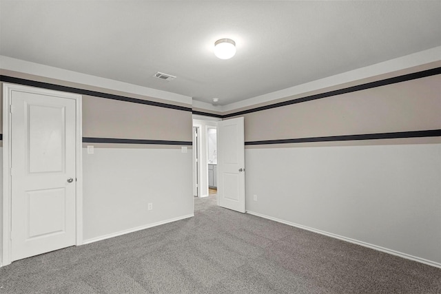 unfurnished bedroom with carpet and a closet