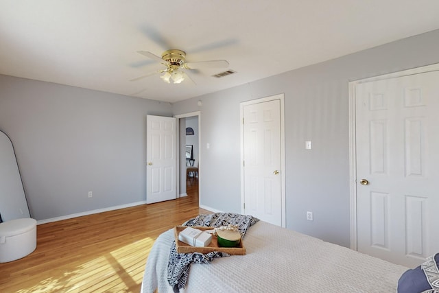 bedroom featuring ceiling fan and hardwood / wood-style flooring