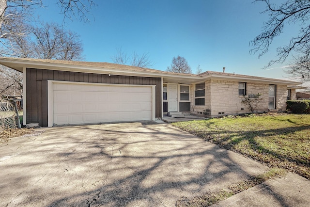 ranch-style house with a front yard and a garage