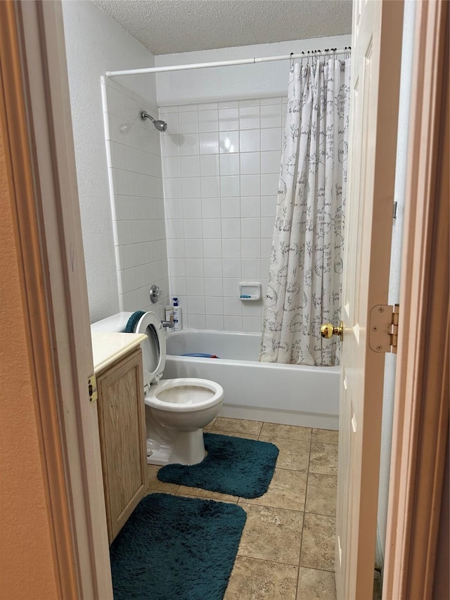 full bathroom featuring toilet, vanity, a textured ceiling, and shower / bathtub combination with curtain