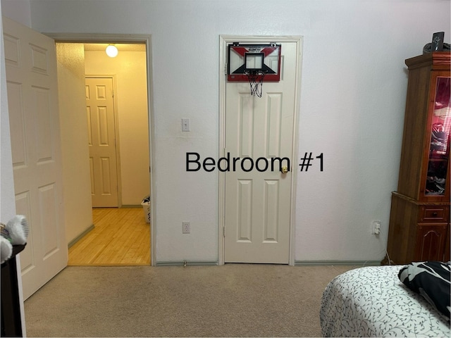 bedroom with light colored carpet