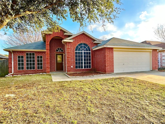 view of front property with a garage and a front lawn