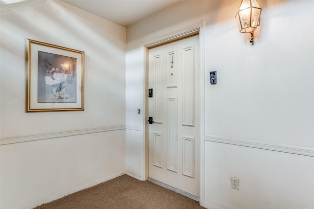 entryway with carpet floors