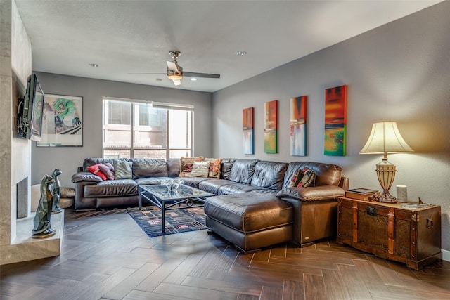 living room with ceiling fan and parquet floors