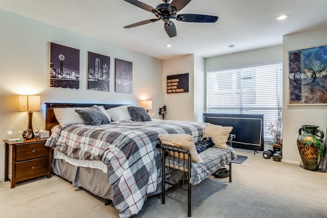 bedroom featuring ceiling fan and light colored carpet