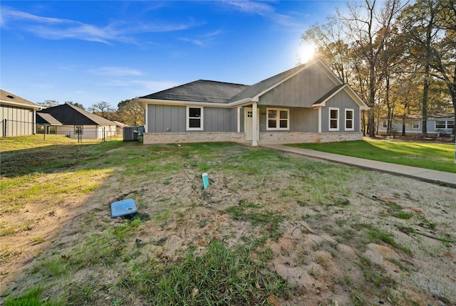 back of property featuring a yard