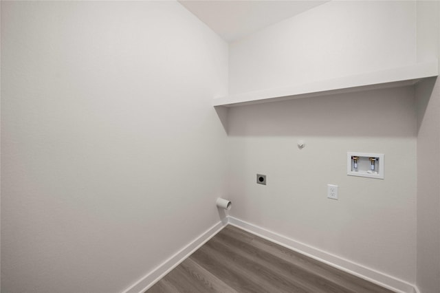 laundry room featuring hookup for an electric dryer, hookup for a gas dryer, dark wood-type flooring, and washer hookup