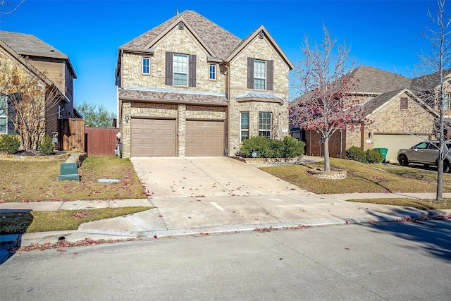 view of front of home with a garage and a front yard