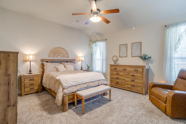 carpeted bedroom featuring vaulted ceiling and ceiling fan