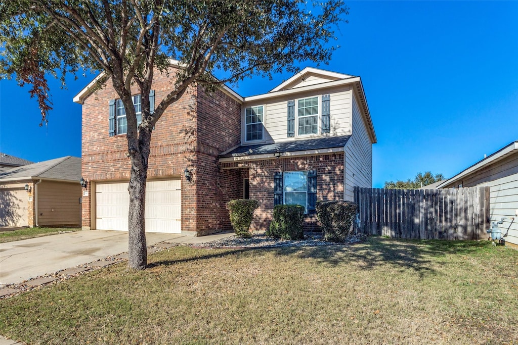 front of property featuring a garage and a front yard