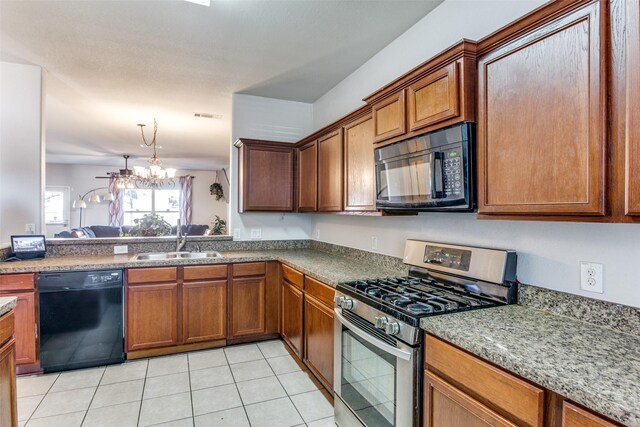 kitchen featuring light tile patterned flooring, sink, and stainless steel appliances